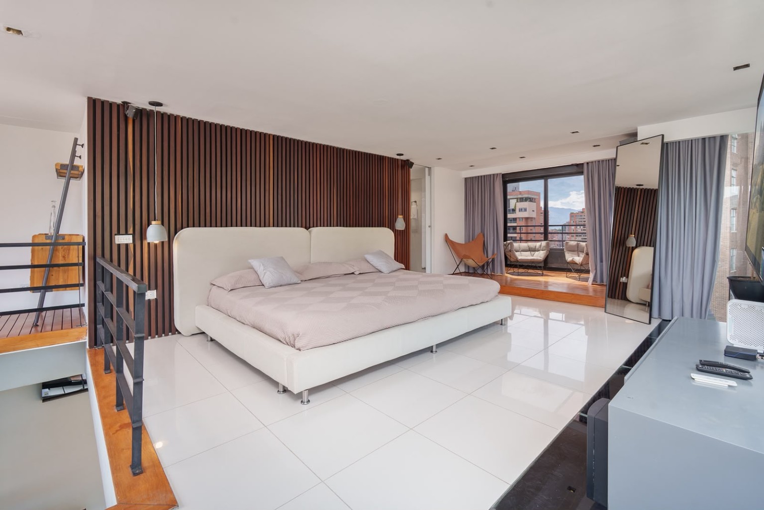 Bright furnished bedroom with balcony